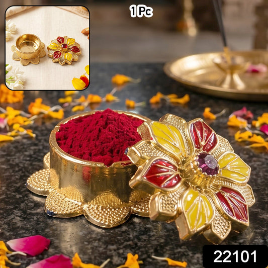 Traditional golden sindoor holder for puja