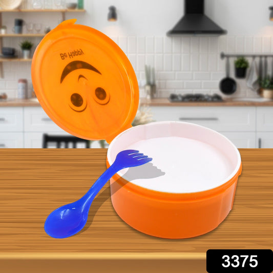Brightly coloured school lunch box with two compartments and an integrated spoon.