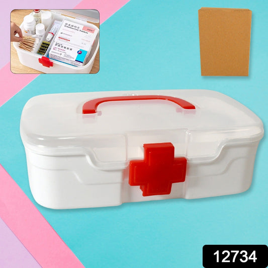 Top-down view of an open medicine storage box, revealing its detachable partitioned tray for organising supplies.