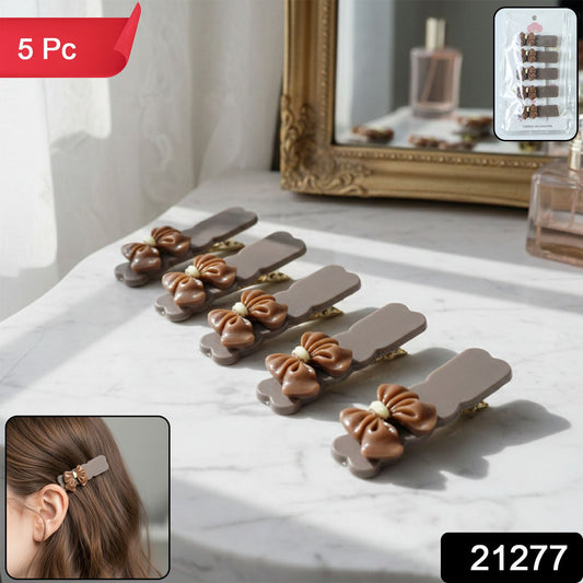 Close-up of heart-shaped decorative bow hair pins in the elegant clip set