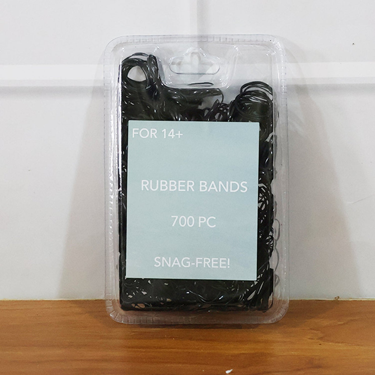 Mini rubber bands arranged to show smooth hold on hair