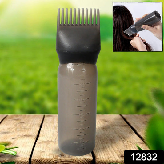 Close-up of the comb applicator brush and pump handle, showing fine bristles.