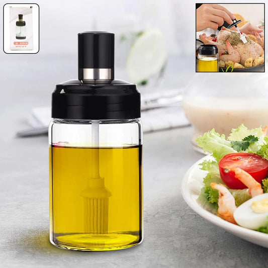 Clear glass oil dispenser bottle with integrated silicone brush for precise application