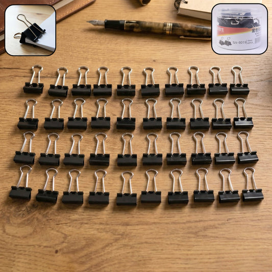 Heavy-duty black binder clips holding papers securely