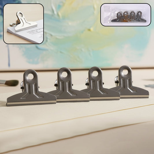 Heavy duty metal paper clamp clips holding documents tightly