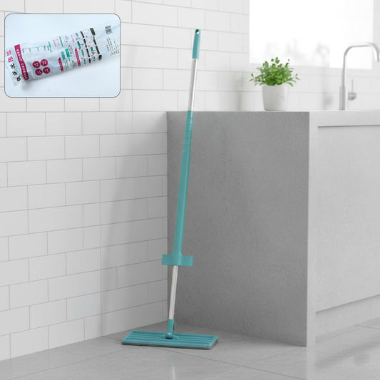 Flat floor cleaning mop with long handle and rectangular mop head on floor