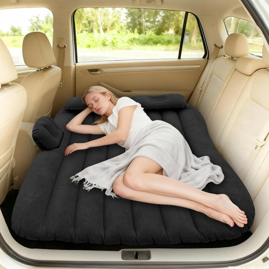 Inflatable car air mattress bed set up on car back seat for comfortable travel