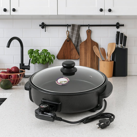 Electric multi-purpose cooker with non-stick surface and transparent lid