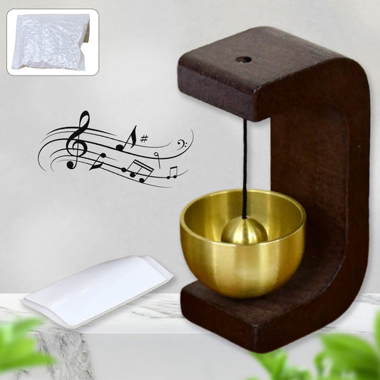 Japanese Style Zen Bell with wooden stand and brass chime ball on desktop