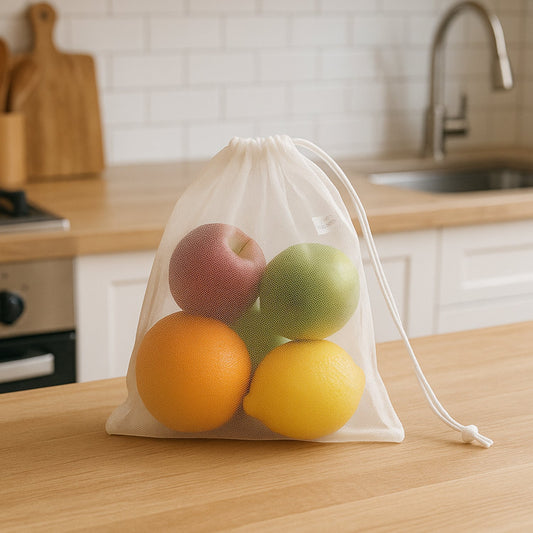 Transparent mesh storage bag holding fresh fruits and vegetables