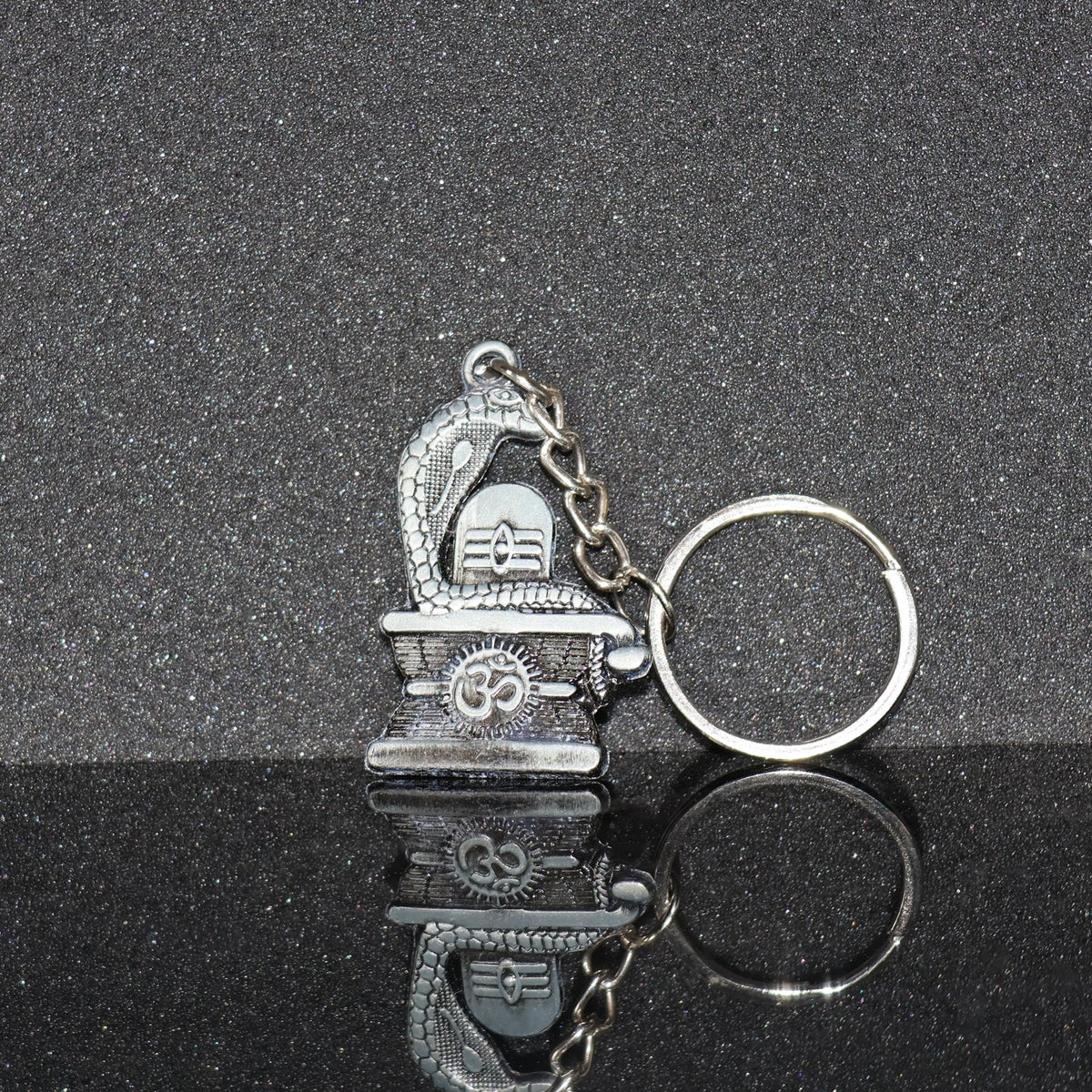 Elegant Shivling keychain with snake design in silver metal