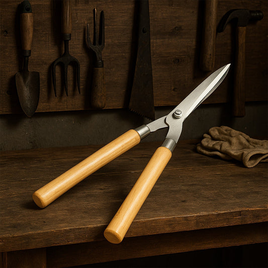 Close-up of the sharp carbon steel wavy blade on Indo Glow Hedge Shears, designed for precise cuts.