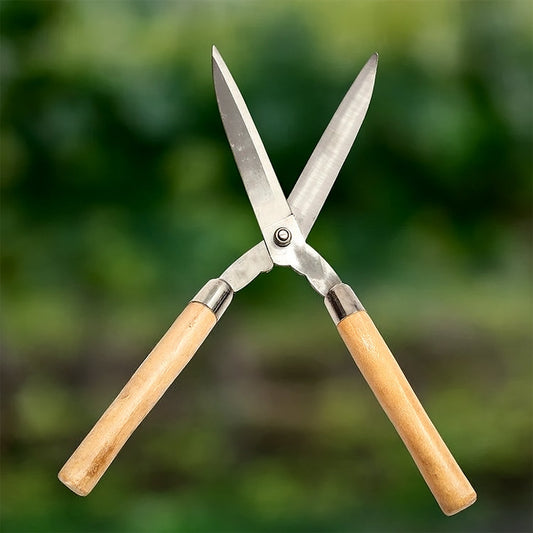 Indo Glow Hedge Shears with ergonomic wooden handles and wavy carbon steel blades for garden trimming.