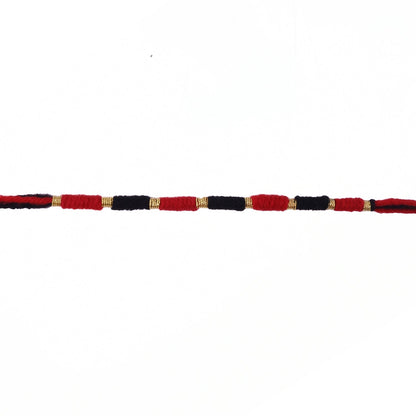 Red and black thread Rakhi with detailed craftsmanship