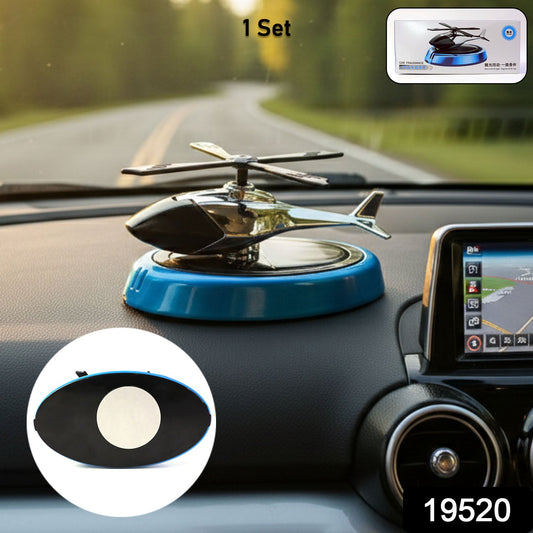 Helicopter car air freshener diffuser with rotating blades on dashboard