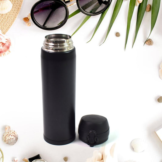 Child holding a vibrant 500ml kids insulated water bottle, perfect for school.