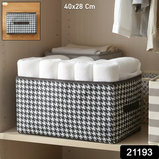 Fabric storage basket organizing clothes on shelf