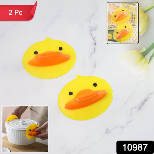 Close-up of duck-shaped silicone hot pot holder with heat resistant surface
