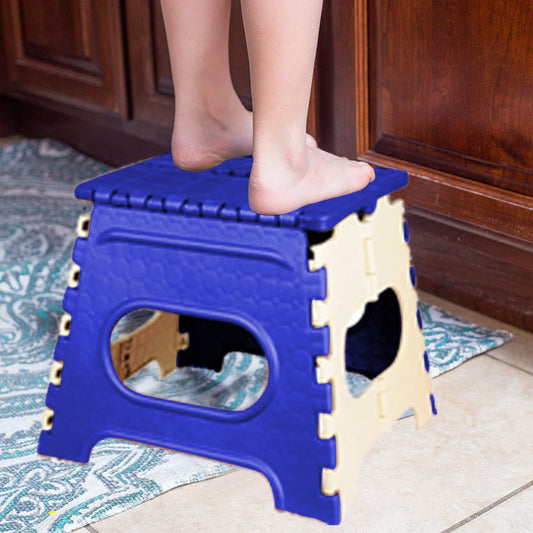 Compact 12-inch folding step stool packaged in a brown box.