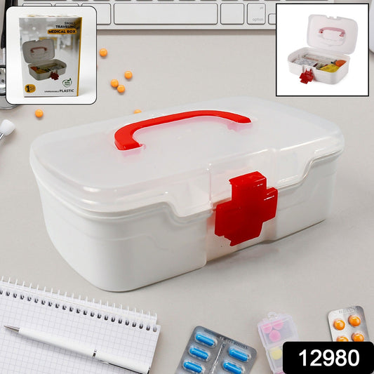 A person's hand comfortably carrying the portable First Aid Box by its integrated handle.
