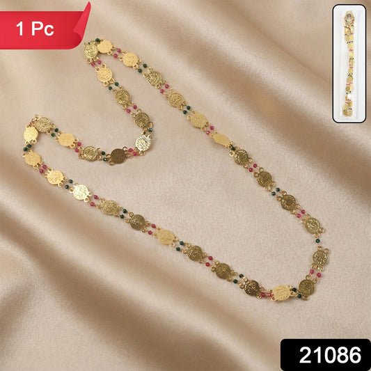 Close-up of multicolor accent beads on traditional gold tone necklace