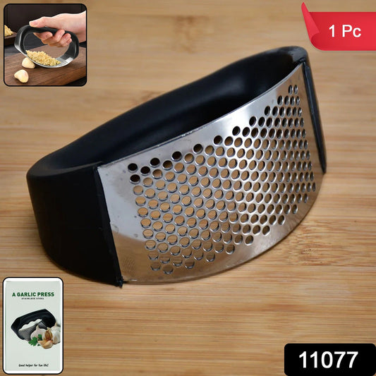 Stainless steel garlic crusher tool ideal for kitchen cooking