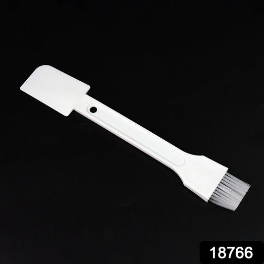 Small dust cleaning brush effectively cleaning keyboard keys.