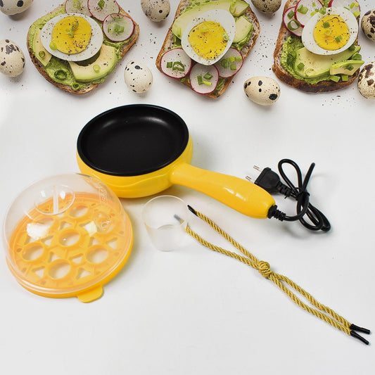 Close-up of the non-stick frying pan surface and egg boiling tray of the electric cooker.