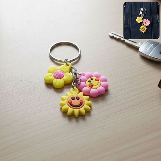 Flower cartoon keychain with colorful triple charm on display
