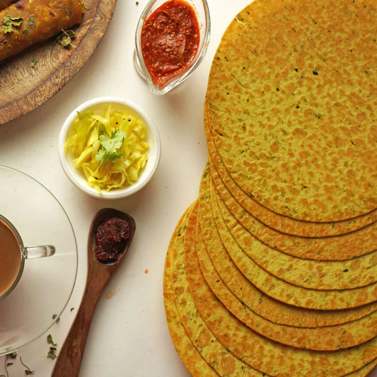 Crispy Methi Khakhra, a popular healthy Indian snack, arranged on a plate.