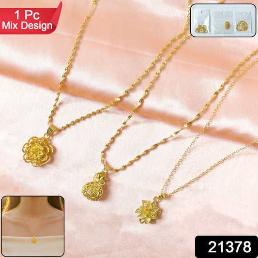 Close-up of floral design gold tone pendant jewelry