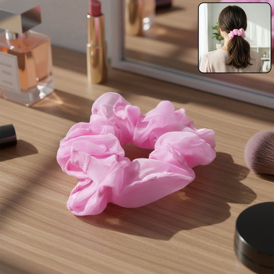 Pink elastic hair tie suitable for ponytails and everyday hairstyling