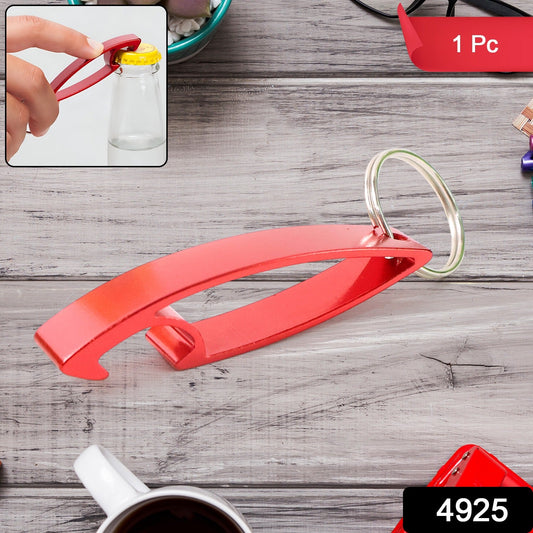 Mini metal bottle opener keychain on a white background