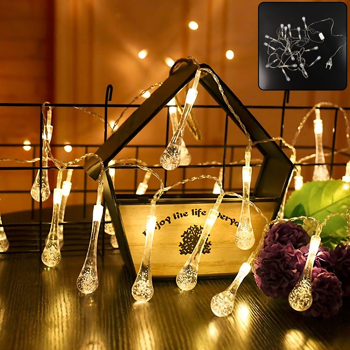 Crystal water drop LED string lights illuminating a festive indoor setting.