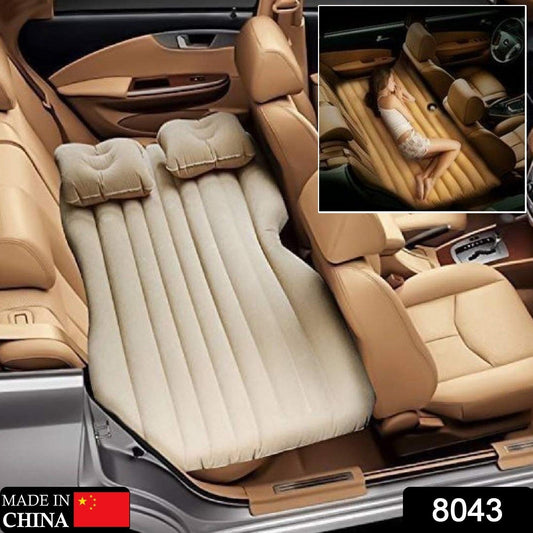 Close-up of the comfortable flocked surface of the inflatable car bed with pillows.