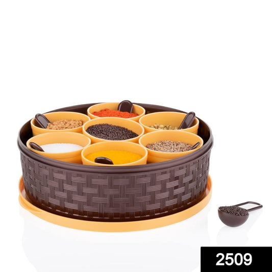 Overhead view of a 7-compartment plastic spice container, empty and ready for filling.