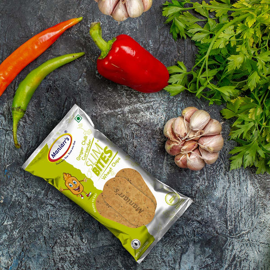 Maniarr's Ginger Chilli Khakhra wheat chips, 58g pack, garnished with fresh coriander.