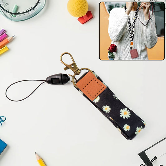 Floral print neck lanyard holding keys and ID badge with daisy design