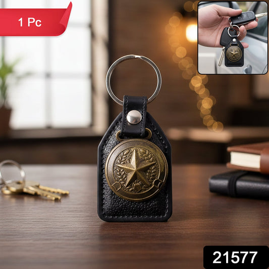 Close-up of metal star emblem on premium leather finish keychain